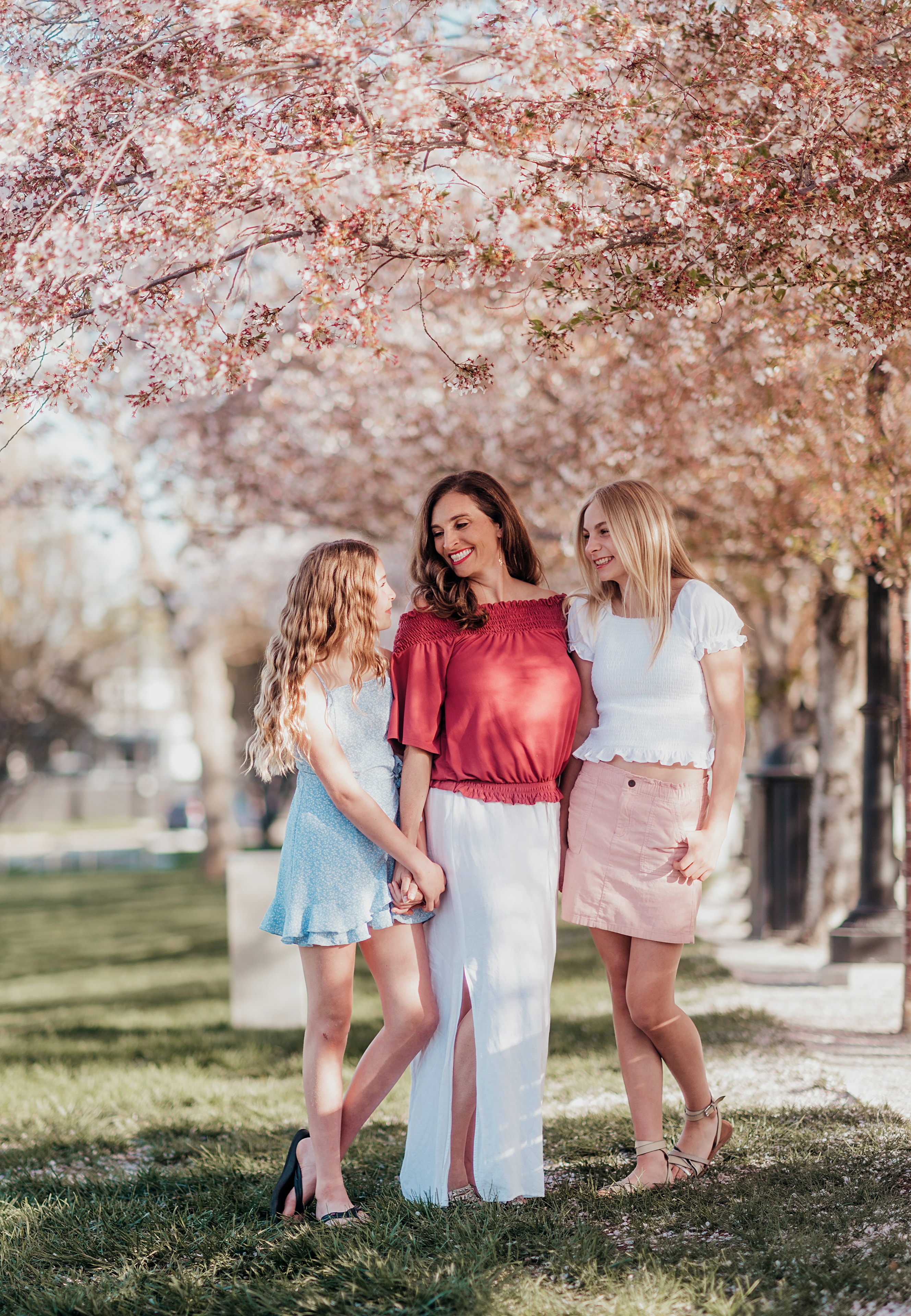 Breanna Rose with her two daughters under cherry blossoms